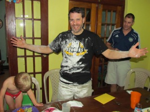 Jamaican tradition of birthday flouring! (Happy he was still smiling after that and a long day of traveling!)